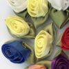 collection of fabric rosebuds for funeral ribbons
